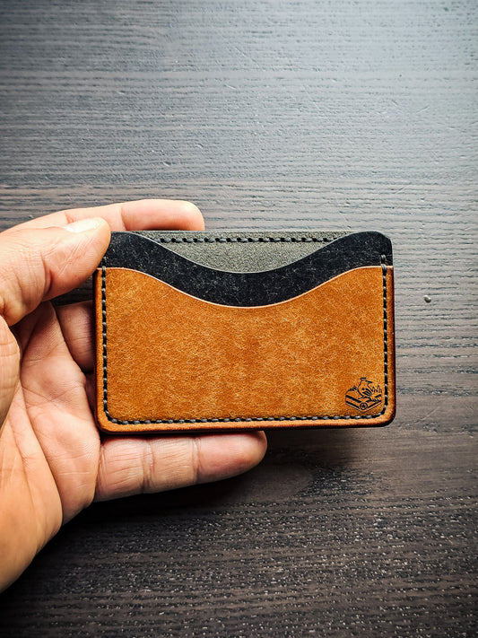 Sidekick leather cardholder shown in hand for size reference