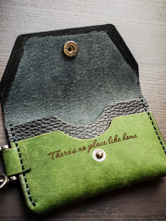 Latchkey leather keychain wallet showing snap closure and interior storage