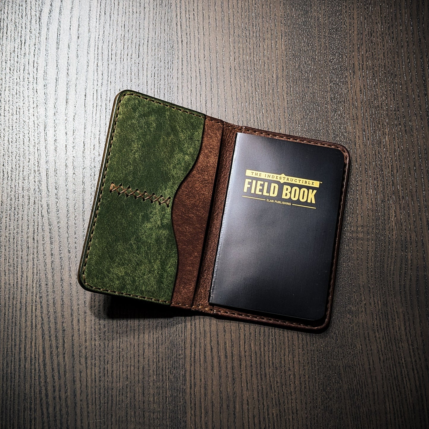 Old Crow leather Field Notes cover in green and brown vegetable-tanned leather