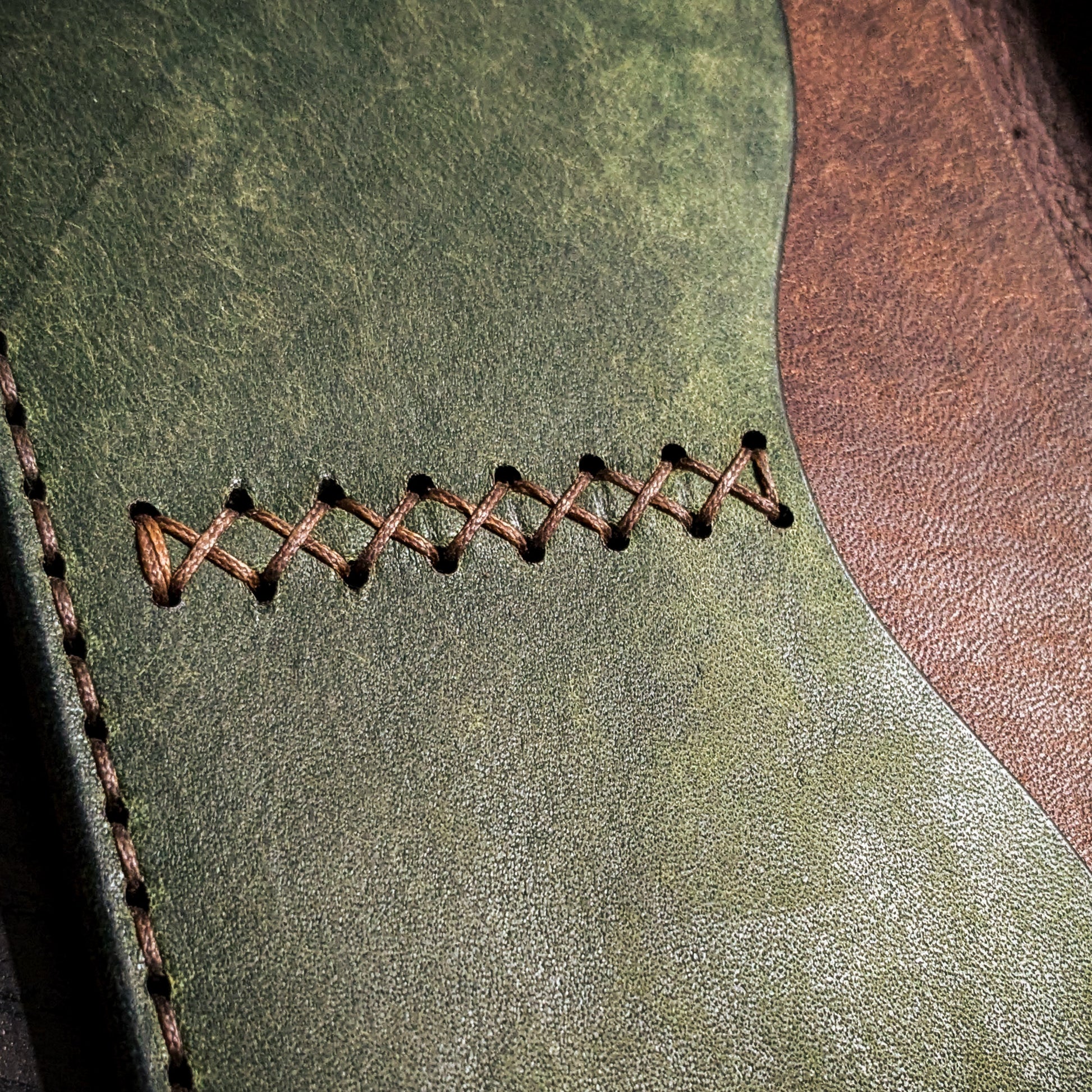 Hand-stitched seam detail on Old Crow leather Field Notes cover