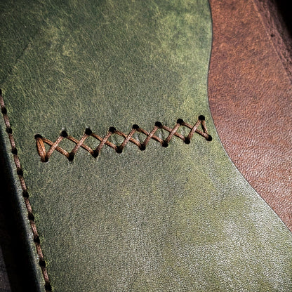 Hand-stitched seam detail on Old Crow leather Field Notes cover