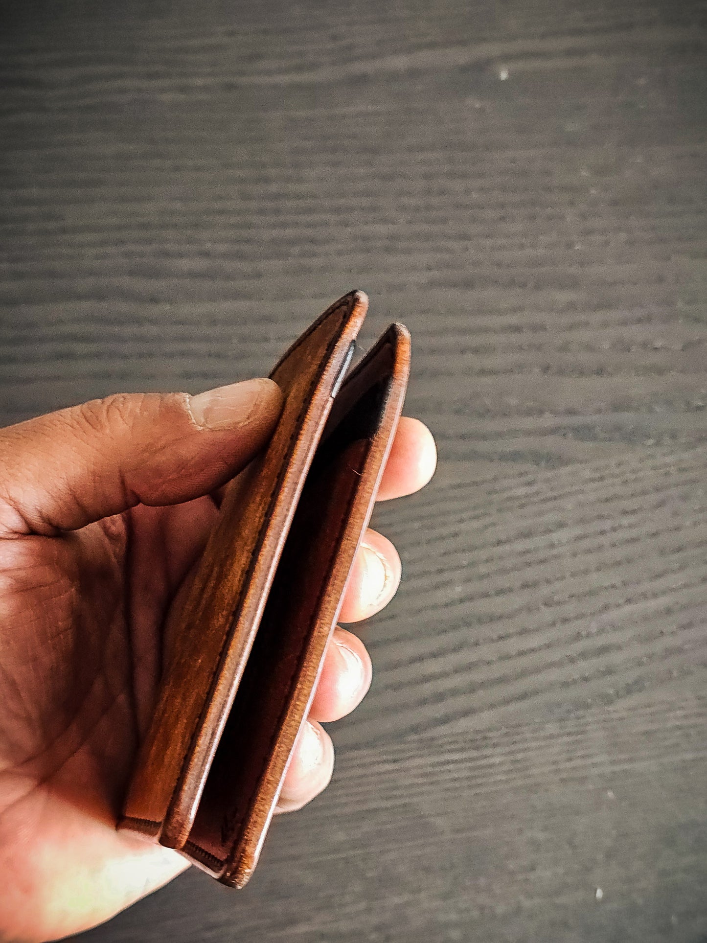 Eastland leather bifold wallet showing folded profile and slim construction