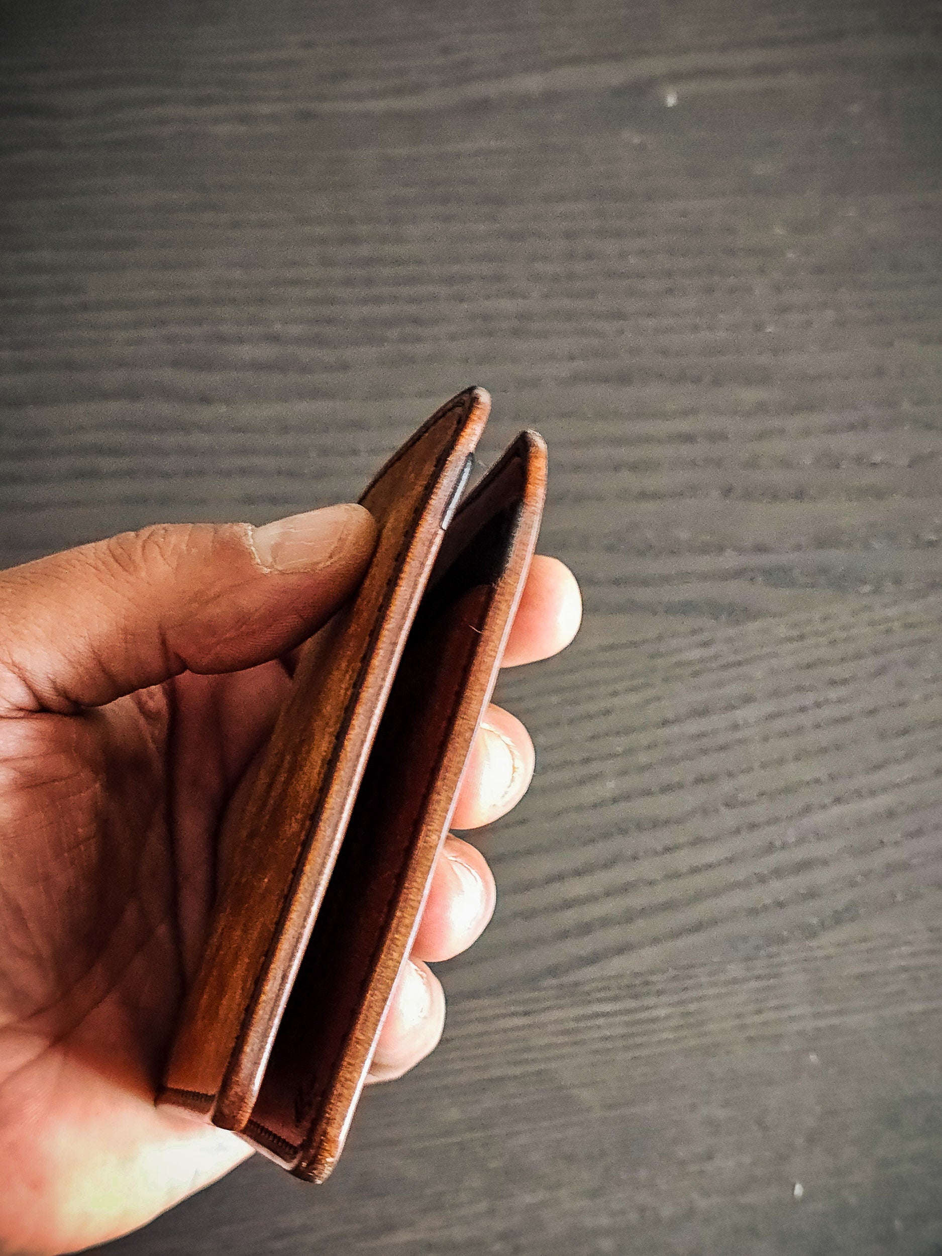 Eastland leather bifold wallet showing folded profile and slim construction