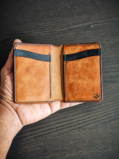 Eastland leather bifold wallet shown in hand with interior card storage