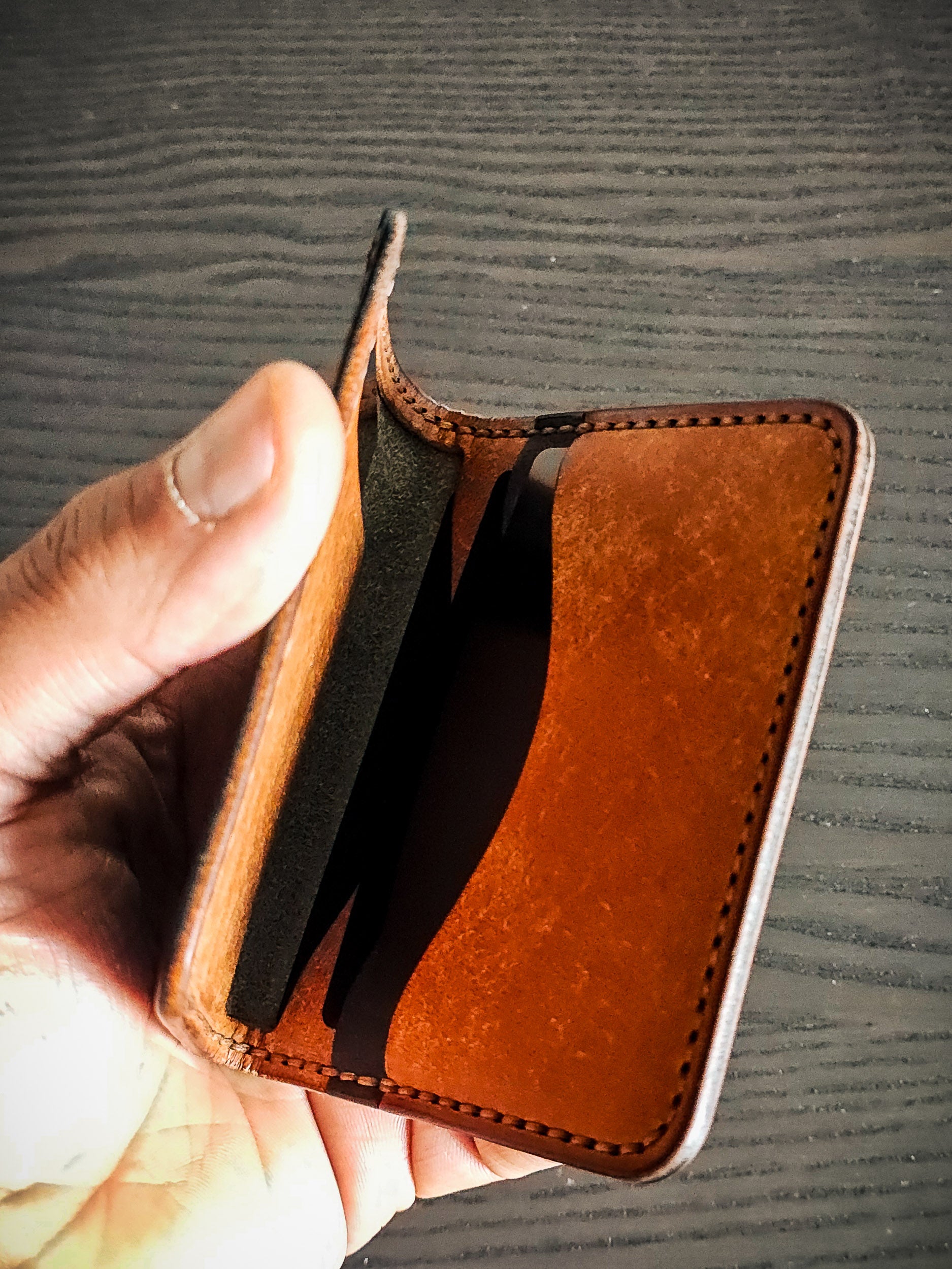 Westfield leather bifold wallet showing folded profile and concealed storage
