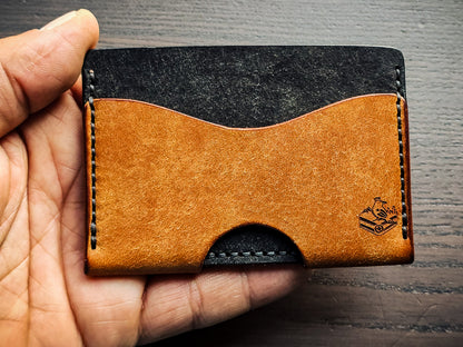 Wingman leather cardholder shown in hand for size reference
