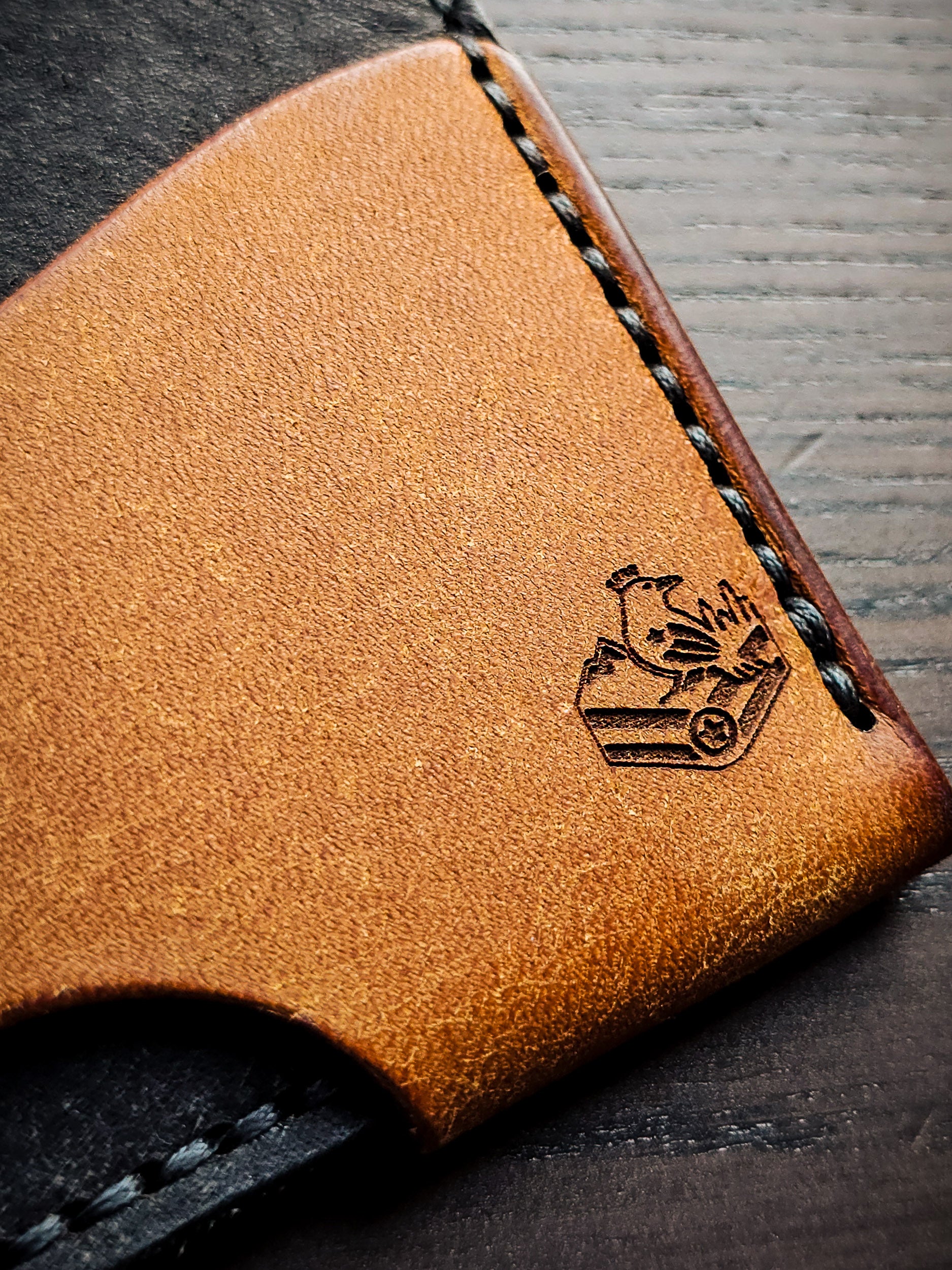 Maker's mark detail on Wingman leather cardholder