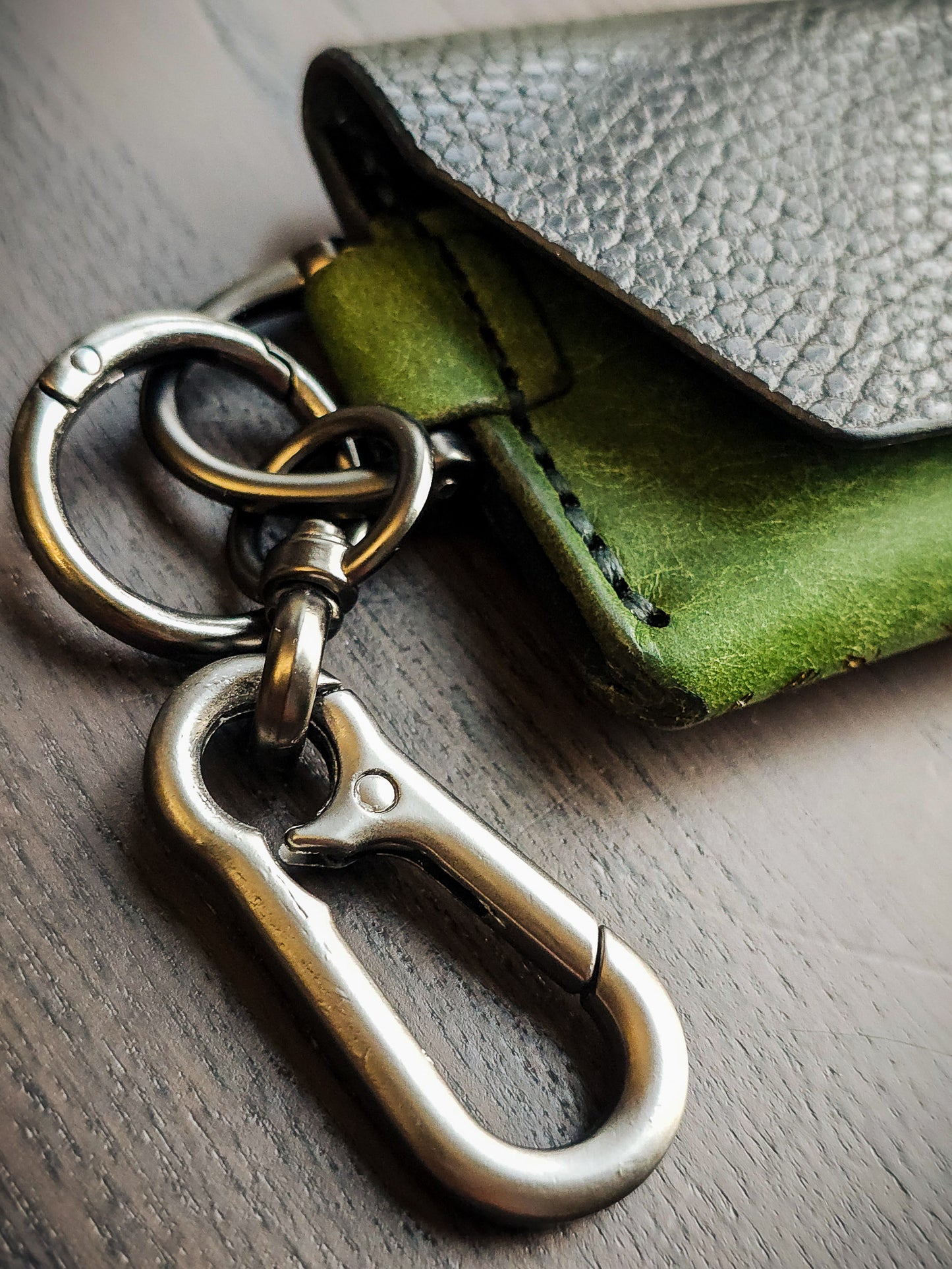 Gunmetal hardware detail on Latchkey leather keychain wallet