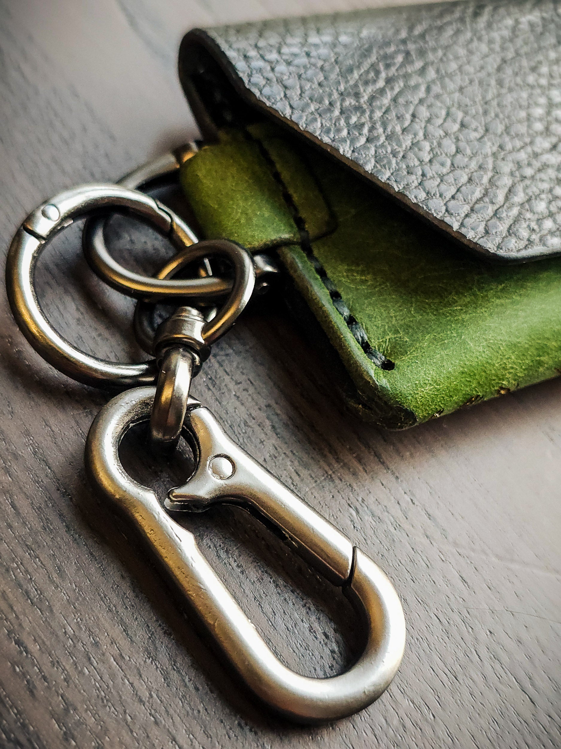 Gunmetal hardware detail on Latchkey leather keychain wallet