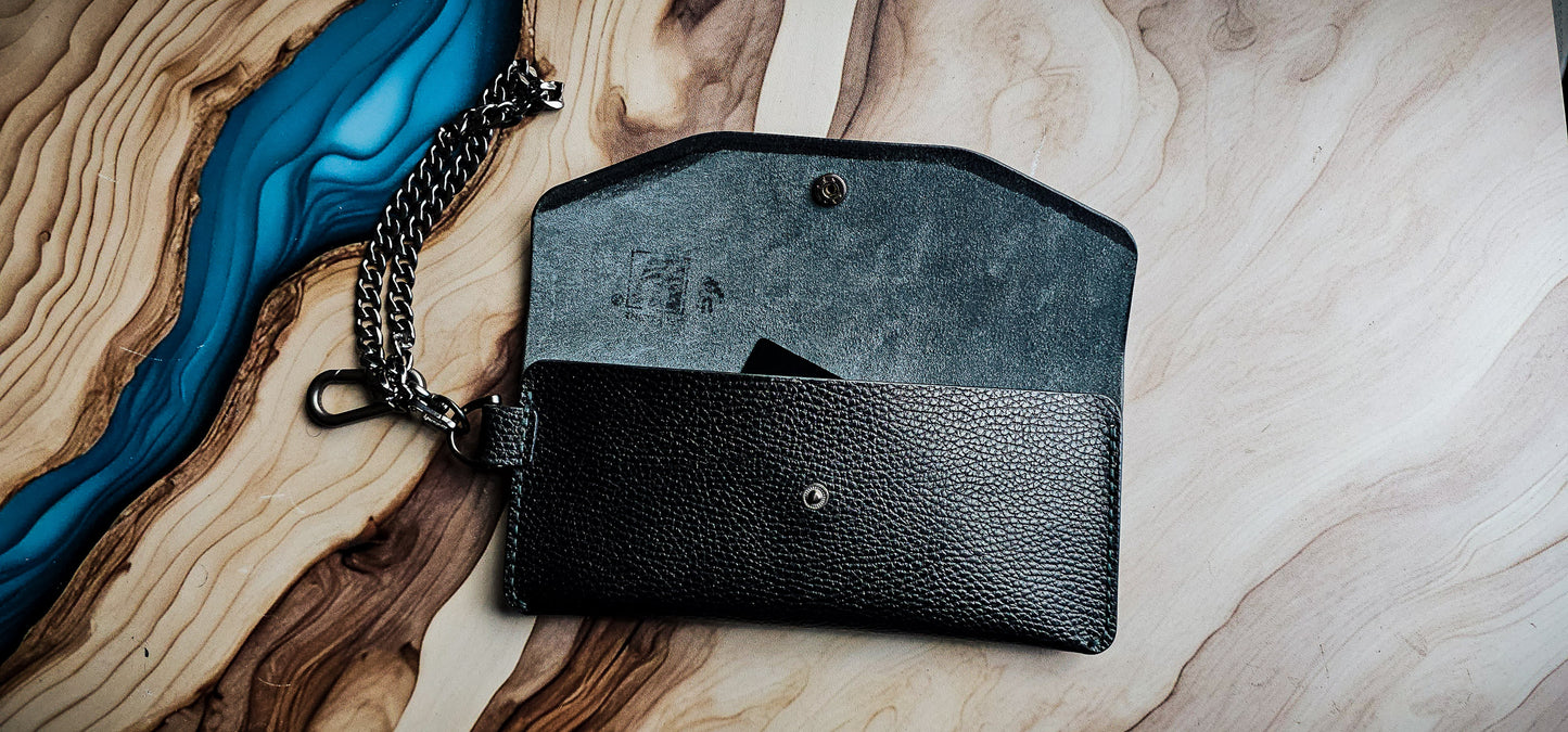 Front view of the Delilah Clutch highlighting the envelope-style flap and silver snap closure.